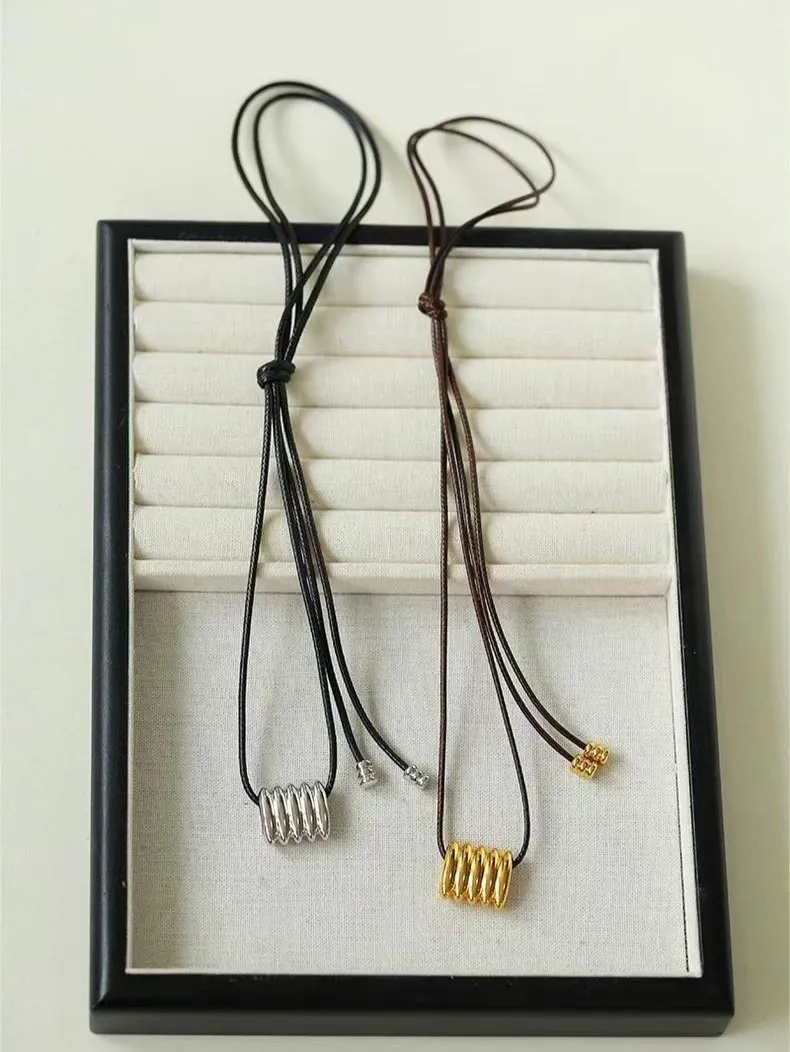 Long Black Leather Necklace with Striped Geometric Pendant